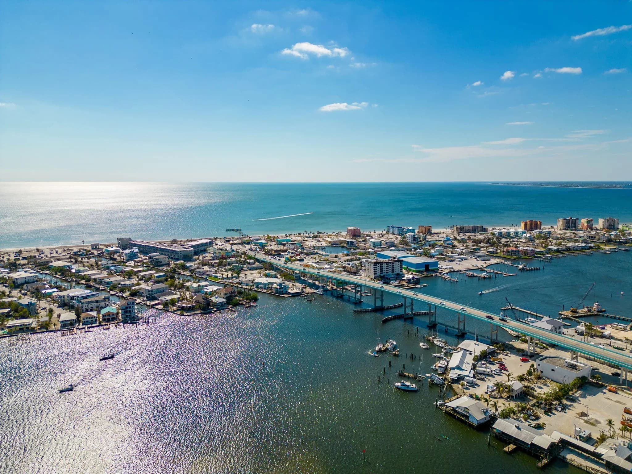Aerial view of downtown Fort Myers Beach, the Matanzas Pass bridge and the Gulf of Mexico