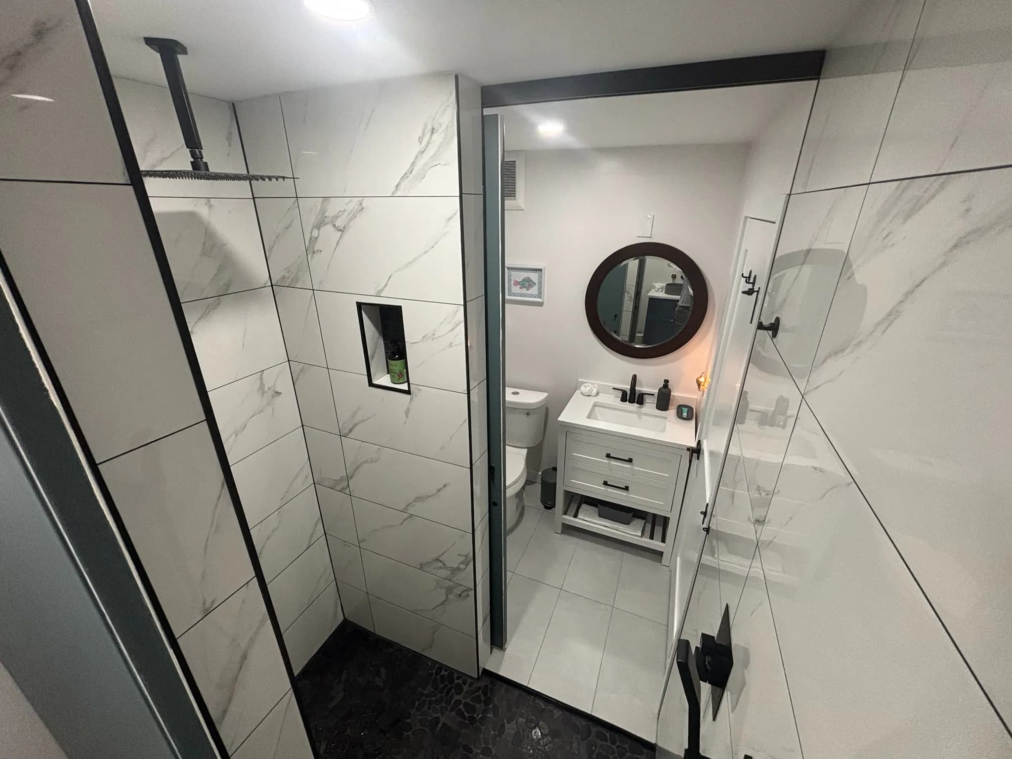 Main House Jack-and-Jill rainfall shower joining the two bedrooms’ half baths